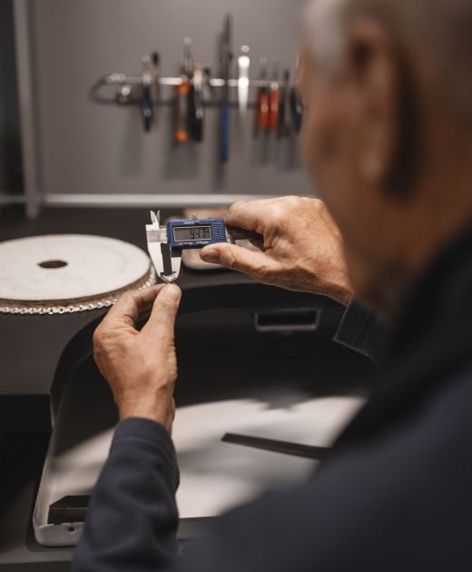 male-jeweler-working-shop-with-measuring-device